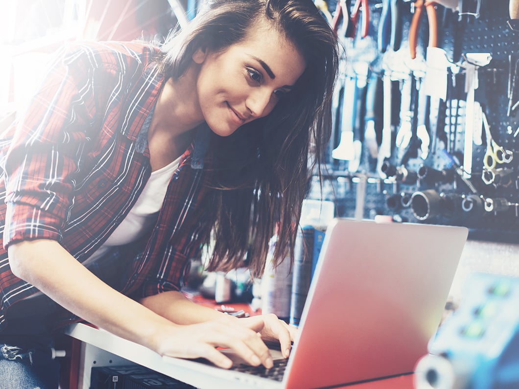 Bike shop owner using laptop